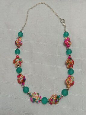 Pretty handmade necklace with little turtles and glass bead